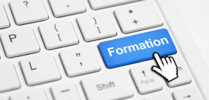 L'action de formation - clavier d'ordinateur avec bouton formation